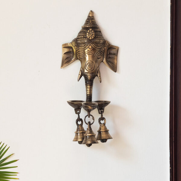 Gleeful Ganesha Hand-Etched Decorative Wall Hanging Diyas With Bells In Brass (500 grams) Gleeful Ganesha Hand-Etched Decorative Wall Hanging Diyas With Bells In Brass (500 grams)