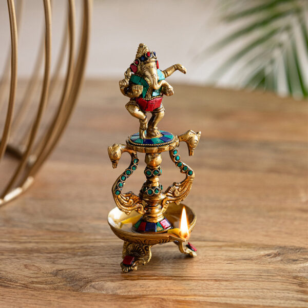 Handcarved 'Ganesha' Brass Diya With Gem Work (1 Wick, 20.1 cm, 20 ml, 800 grams, Hand-Etched) Handcarved 'Ganesha' Brass Diya With Gem Work (1 Wick, 20.1 cm, 20 ml, 800 grams, Hand-Etched)