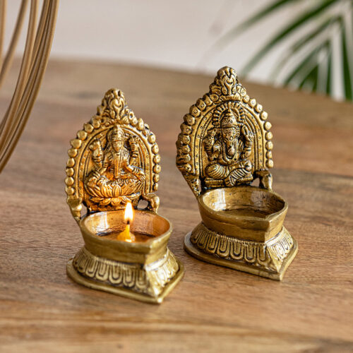 Handcarved 'Laxmi Ganesha Pair' Brass Diyas (Set of 2, Hand-Etched, 10.7 cm, 20 ml, 580 grams Each) Handcarved 'Laxmi Ganesha Pair' Brass Diyas (Set of 2, Hand-Etched, 10.7 cm, 20 ml, 580 grams Each)
