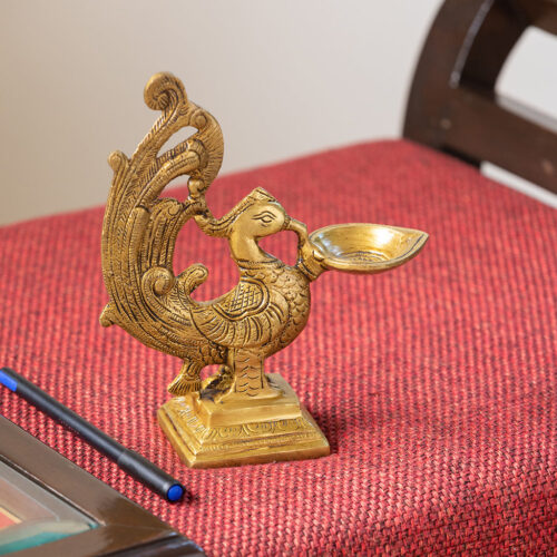 Marvellous Peacock' Hand-Etched Carved Diya In Brass (830 grams) Marvellous Peacock' Hand-Etched Carved Diya In Brass (830 grams)