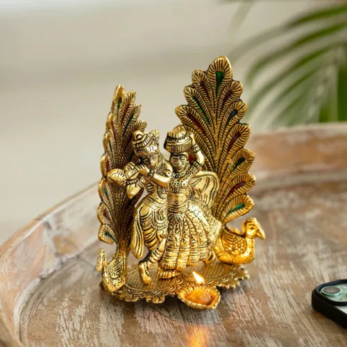 'Radha-Krishna & Peacock' Idol Showpiece Figurine with Diya (1 Wick, 17.5 cm, Golden, Metal, Handcrafted) 'Radha-Krishna & Peacock' Idol Showpiece Figurine with Diya (1 Wick, 17.5 cm, Golden, Metal, Handcrafted)