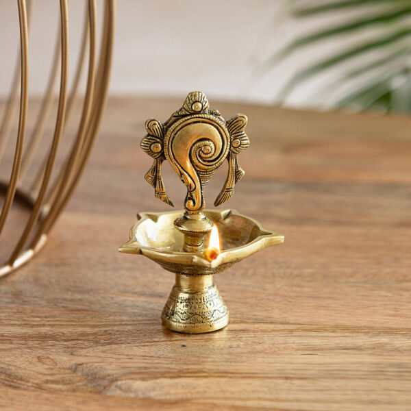 'Shankh Balaji' Handcarved Brass Diya (5 Wicks, 16 cm, 30 ml, 720 grams, Hand-Etched) 'Shankh Balaji' Handcarved Brass Diya (5 Wicks, 16 cm, 30 ml, 720 grams, Hand-Etched)
