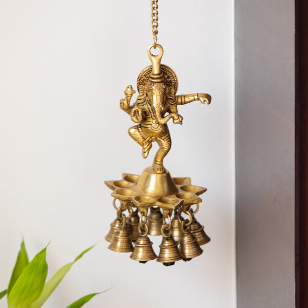 Swaying Ganesha' Hand-Etched Decorative Hanging Diya With Bell In Brass (9 Diyas & Bells, 1.20 kg) Swaying Ganesha' Hand-Etched Decorative Hanging Diya With Bell In Brass (9 Diyas & Bells, 1.20 kg)